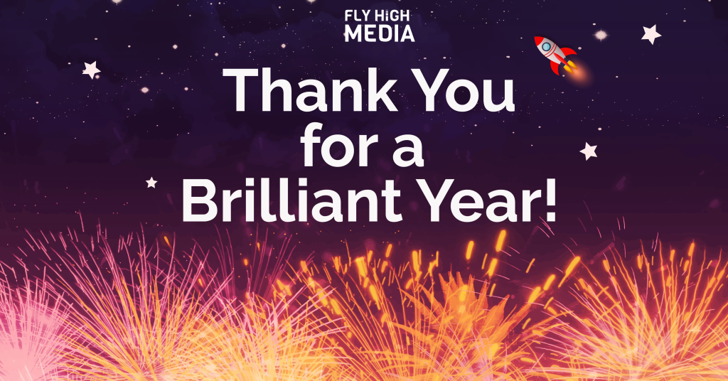 Fireworks display beneath a space sky which contain stars and one rocketship, and the text 'thank you for a brilliant year' in the top centre with the fly high media logo above it